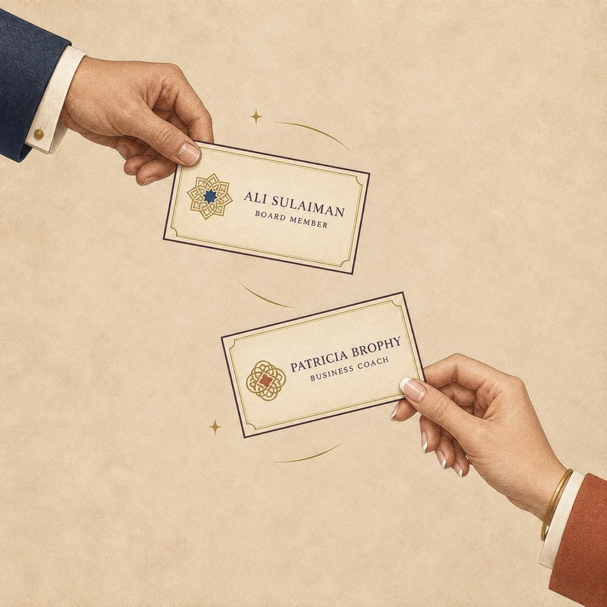 Two hands exchanging business cards